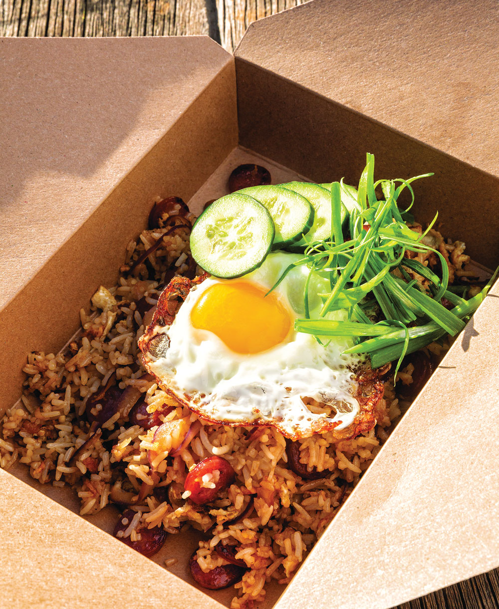 Sunny-topped fried rice with sweet and savory Chinese sausage from Mu Noi Brunch