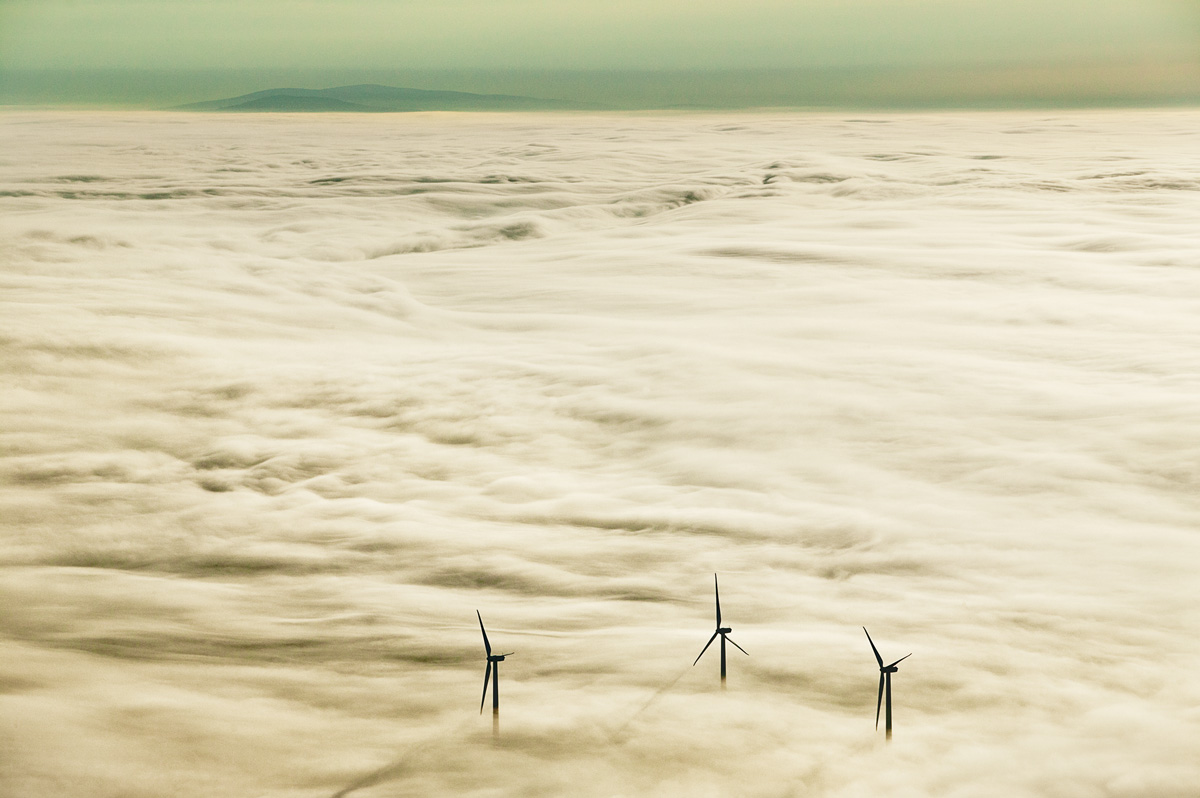 Vinalhaven’s wind farm rises through the clouds. Ralston calls this image Prophets, a nod to “the vision it took on the part of the community to make this extraordinary project happen.”