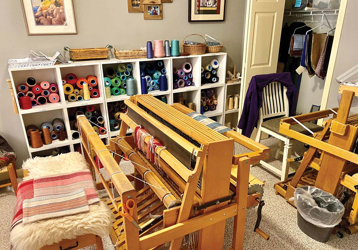 The looms where RiverWoods Exeter resident Andrea Williams weaves her scarves, table runners, and other works