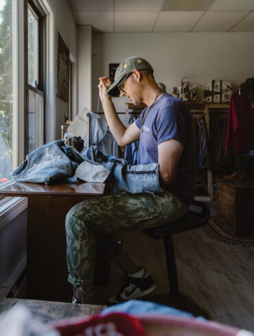 Designer Jared DeSimio sewing in his Brunswick studio