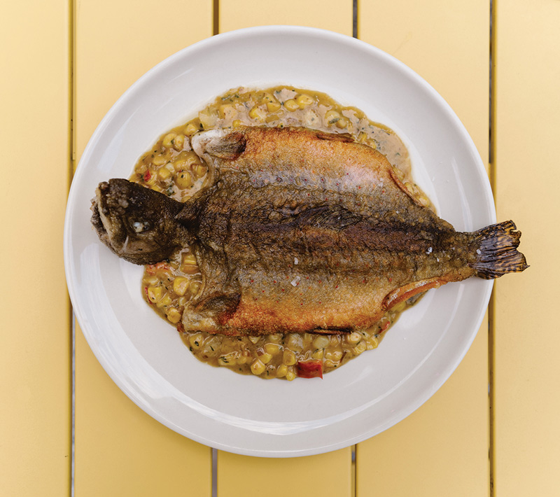 Whole trout in a summer-vegetable succotash