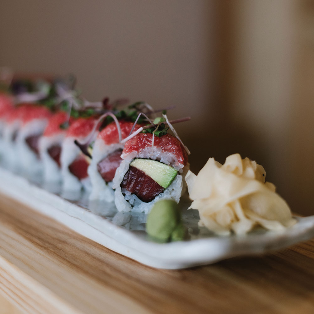 Miyake’s Super Toro Roll filled with tuna and avocado and topped with diced toro, scallions, and microgreens.
