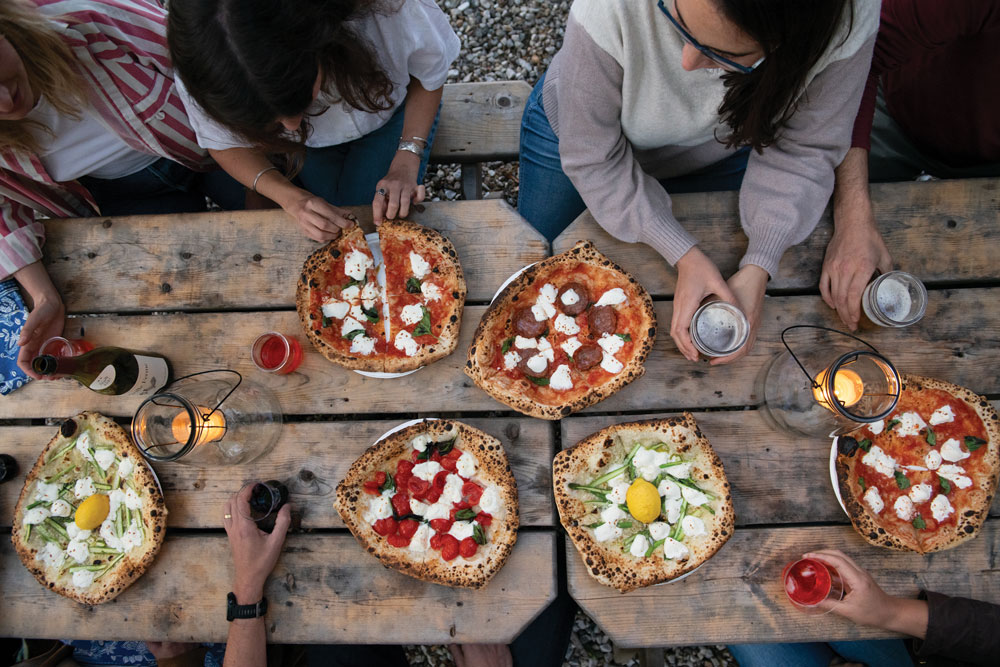 Margherita, salami, asparagus, and cherry-tomato pizzas from Il Leone