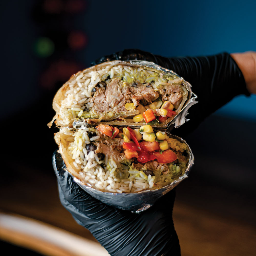 burrito stuffed with smoked meat, rice, black beans, corn, peppers and salsa from Bub’s Burritos