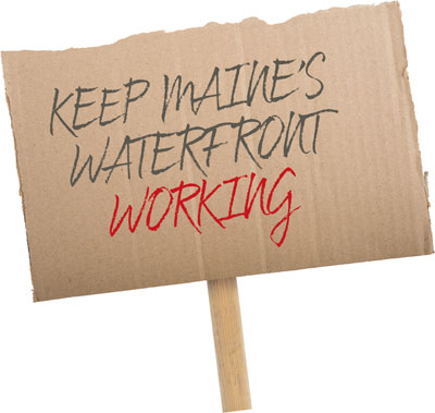 cardboard sign that reads "KEEP MAINE'S WATERFRONT WORKING"