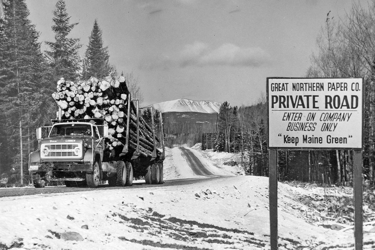 truck and sign on the golden road in Millinocket