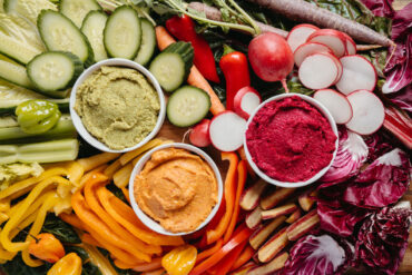 Harvest Maine dips and spreads nestled in a colorful vegetable platter