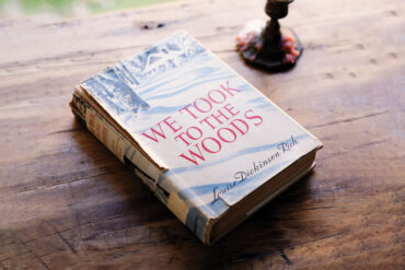 a copy of "We Took to the Woods," by Louise Dickinson Rich on a table
